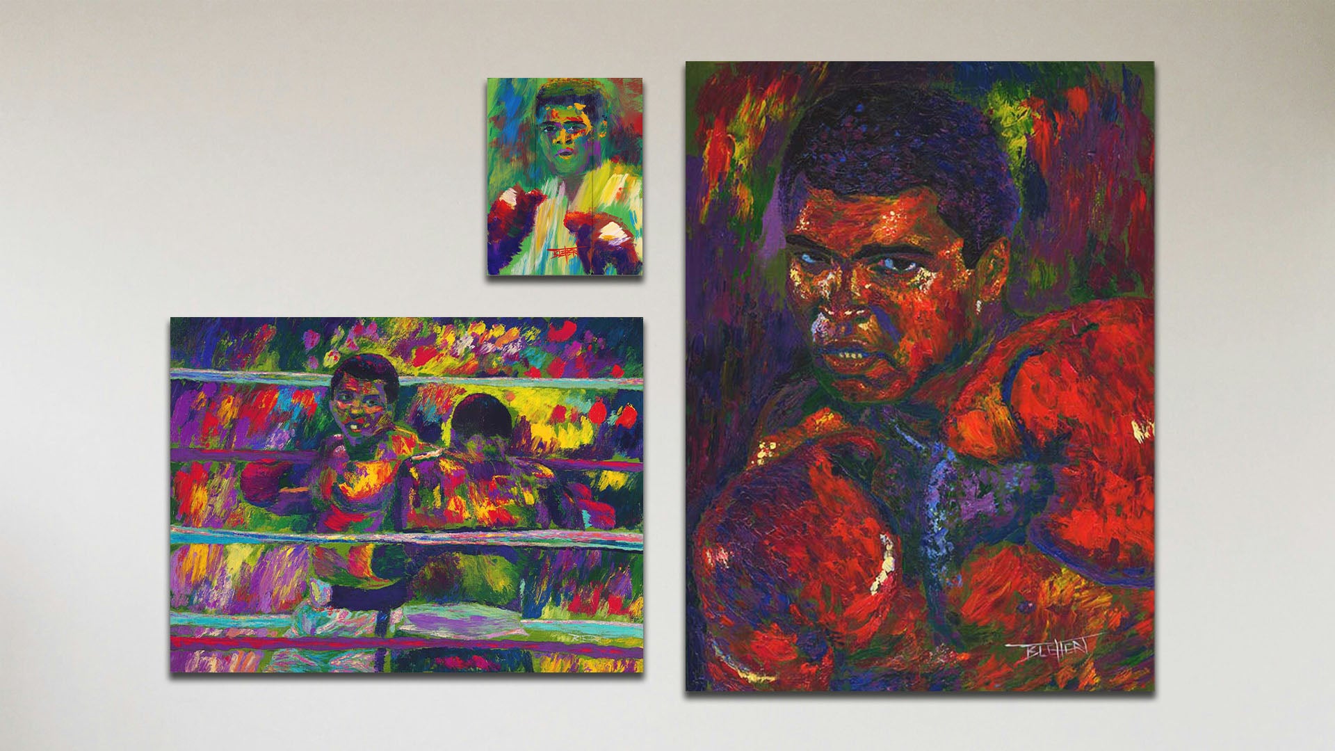 A collage of art in the standard Muhammad Ali package, including a canvas painting of Muhammad Ali, a canvas painting of Muhammad Ali fighting Joe Frazier, and a box board painting of Muhammad Ali.