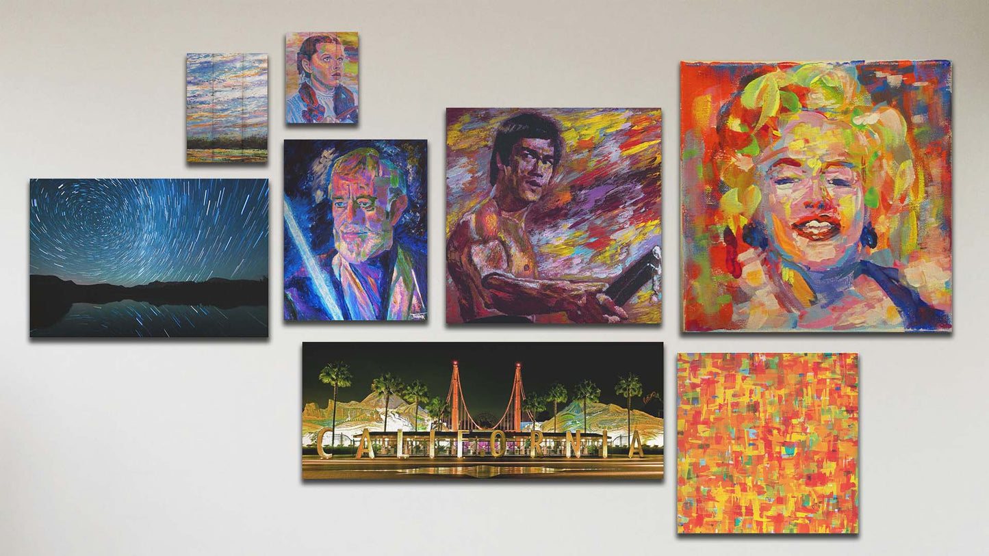 A collage of art in the designer film package, including two box board paintings of a wide open sky and Judy Garland as Dorothy in The Wizard of Oz; two canvas photographs of the California Adventure sign and the stars over Mirror Lake; and four canvas paintings of Marilyn Monroe, an abstract colorful contemporary pattern, Alec Guinness as Obi-Wan Kenobi in Star Wars, and Bruce Lee.