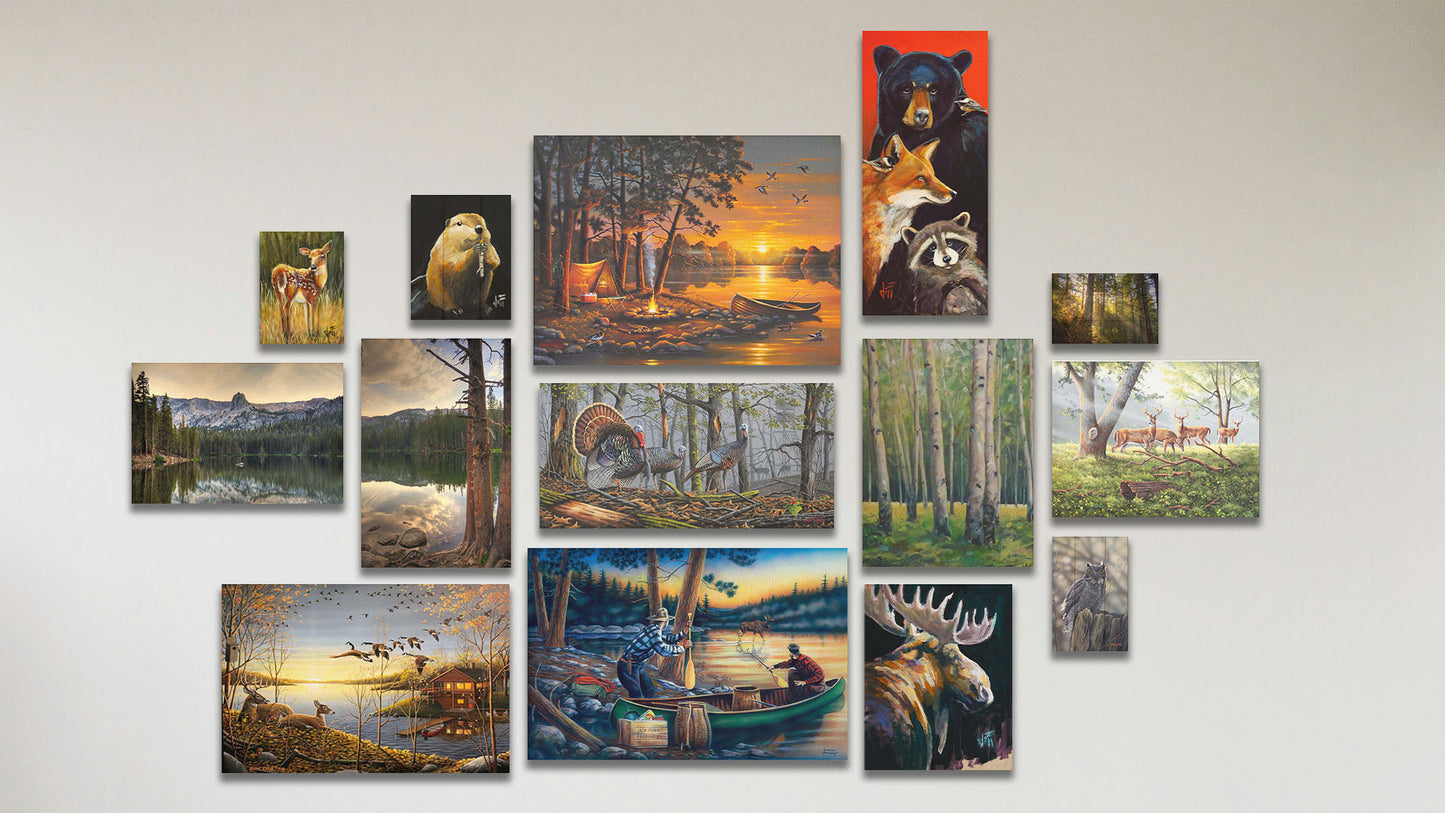 A collage of art in the standard Lucky Break package, including eight canvas paintings of turkeys in the woods, a lake camp at sunset, a lake cabin at sunset, a moose, deer in a forest, a birch forest, canoers at sunset, and a bear, fox, and raccoon; two canvas photographs of Mamie Lake; three box board paintings of a deer, a beaver, and an owl; and a box board photograph of Burney Forest in California.