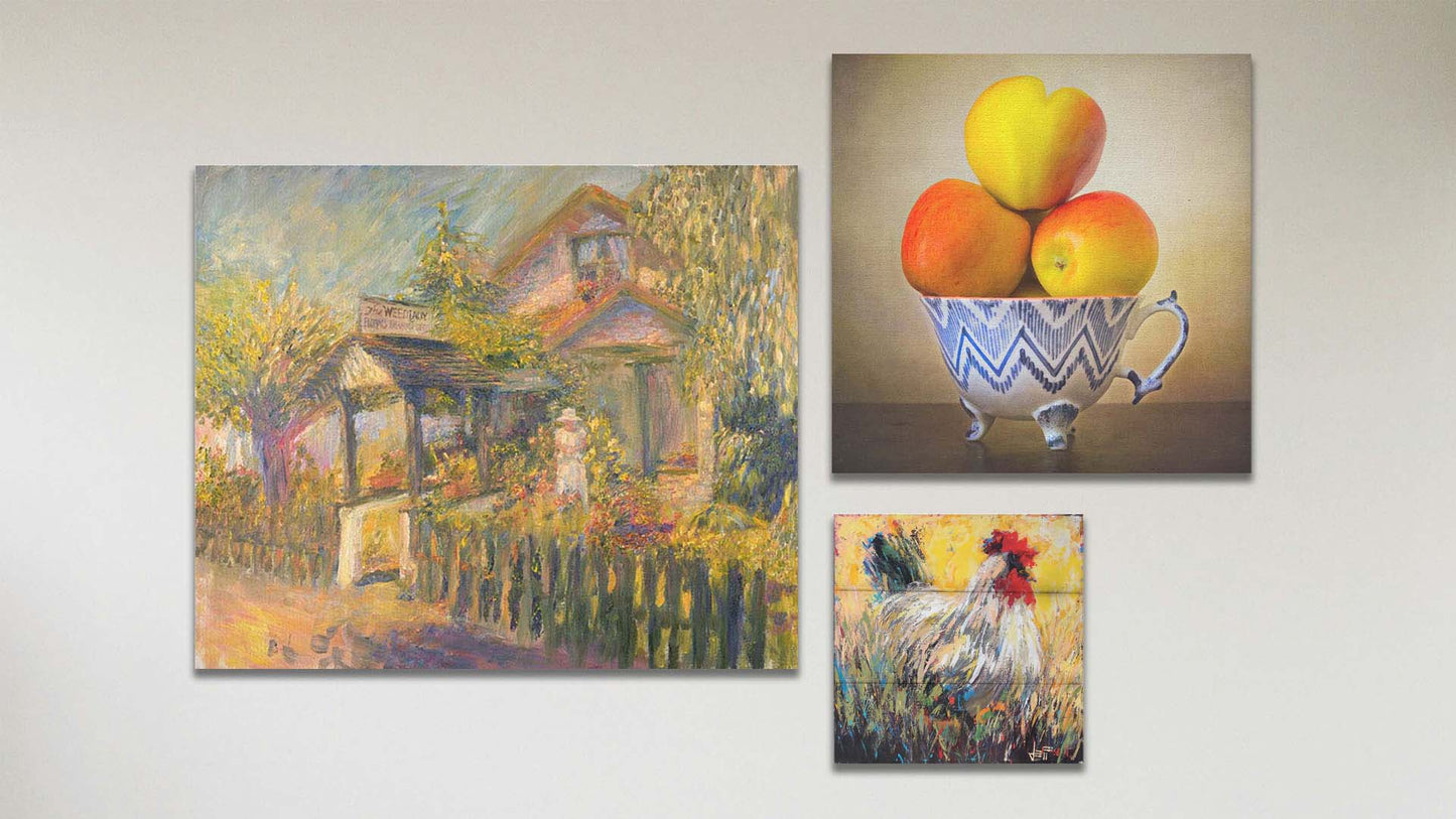 A collage of art in the standard Place to Remember package, including a canvas painting of a garden store, a canvas photo still life of apples, and a box board painting of a rooster.