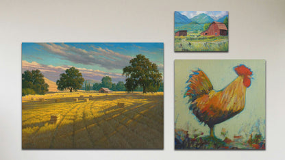 A collage of art in the luxury Sunset Hayfield package, including a box board painting of a barn in the mountains, a canvas painting of an orange rooster, and a canvas painting of a hayfield at sunset.