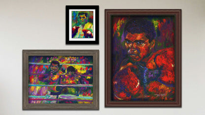 A collage of art in the designer Muhammad Ali package, including a framed painting of Muhammad Ali, a framed painting of Muhammad Ali fighting Joe Frazier, and a matted and framed painting of Muhammad Ali.