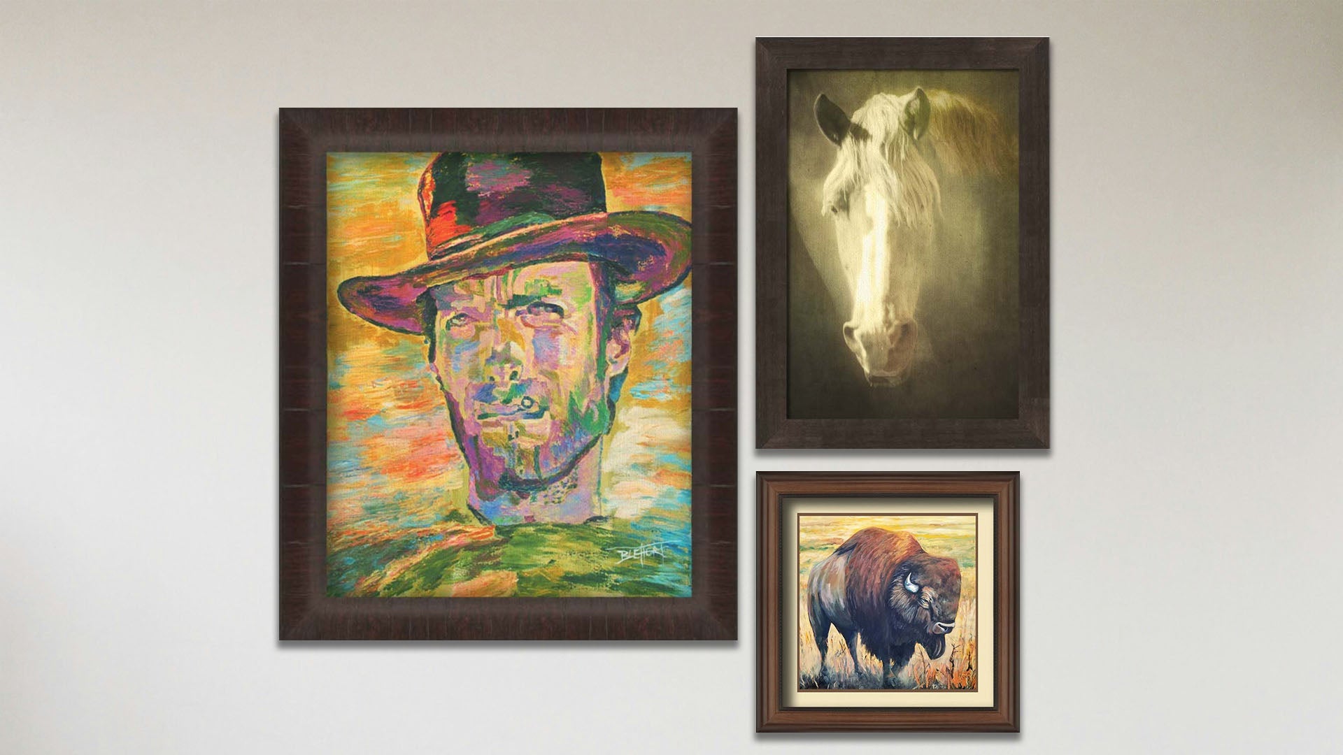 A collage of art in the designer Clint Eastwood package, including a framed painting of Clint Eastwood, a framed photograph of a sepia horse, and a matted and framed painting of a bison.