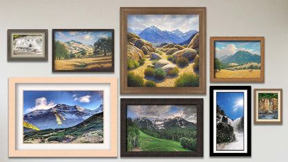 A collage of art in the designer First Snow Timpanogos package, including three matted and framed photos of Mount Timpanogos, a small waterfall at an old mill, and Diamond Fork hot spring in Utah; three framed paintings of Mount Whitney and Mount Diablo, a framed photo of Sundance Ski Resort; and a matted and framed painting of a waterside cliff face.