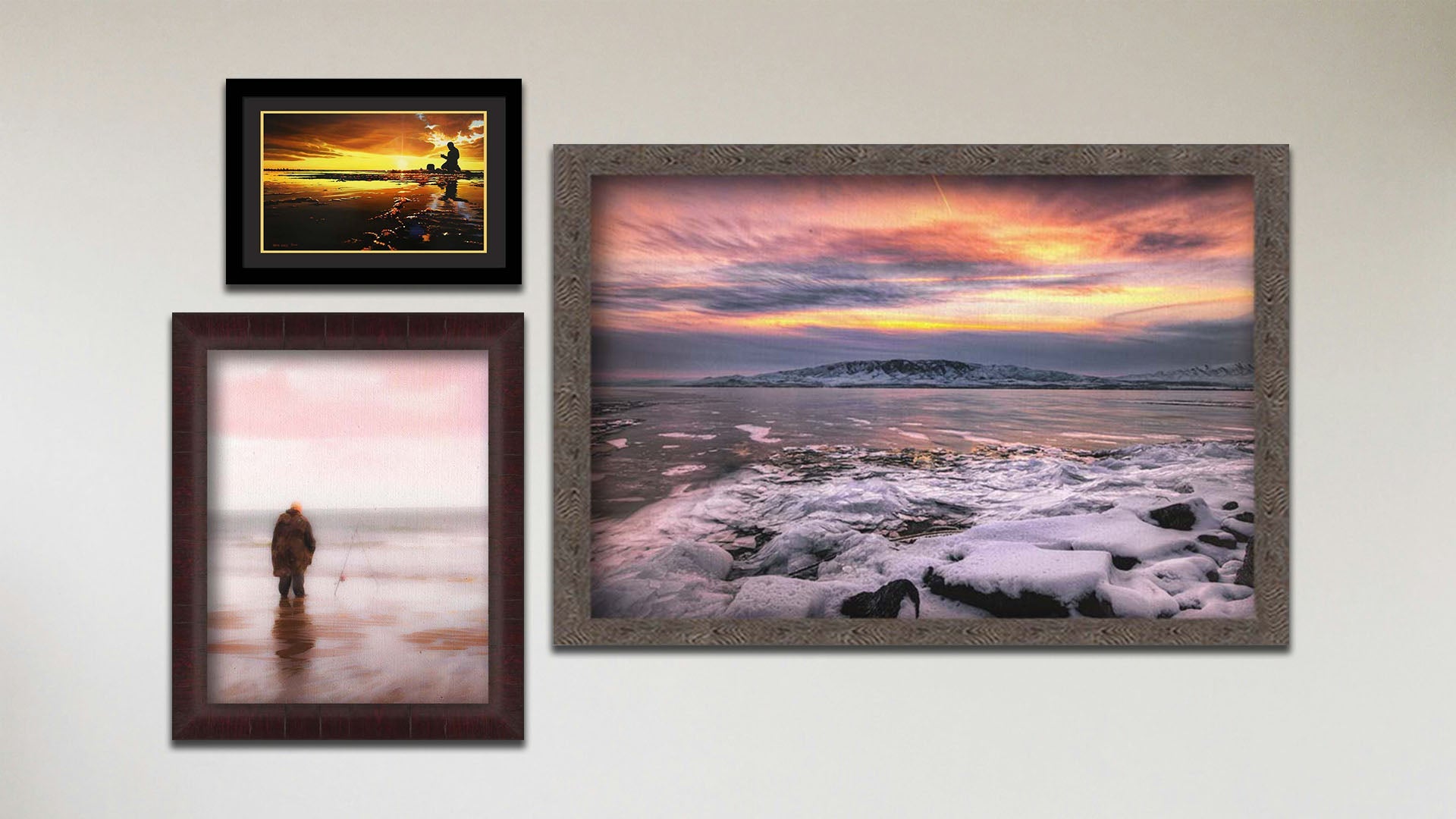 A collage of art in the designer Tranquil Harbor package, including a float framed photograph of a sunset over a snowy shore, a float framed photograph of a fisherman watching their line in the ocean shallows, and a matted and framed painting of a person fishing on an icy shore.