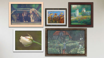 A collage of art in the luxury Green Dream package, including three framed paintings of a walled garden, three dogs riding in a car, and a cottage surrounded by a garden; a framed photograph of a white rose; and a matted and framed painting of coneflowers.