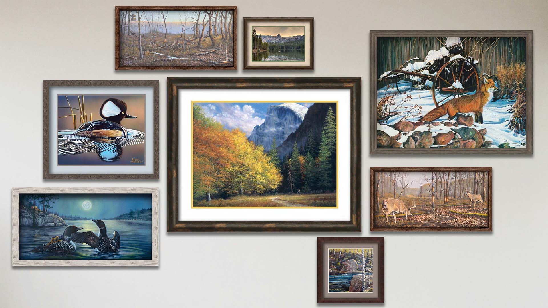 A collage of art in the designer Hiking to Half Dome package, including four framed paintings of a family of loons swimming on a moonlit lake, a fight between two deer bucks, a red fox standing on alert in the snow, and deer trekking through wintery woods; three matted and framed paintings of a hooded merganser duck, a wooded trail at the Half Dome batholith at Yosemite National Park in California, and a stream through a birch forest; and a matted and framed photo of Lake Mamie in California.