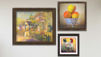 A collage of art in the designer Place to Remember package, including a framed painting of a garden store, a framed photo still life of apples, and a matted and framed painting of a rooster.