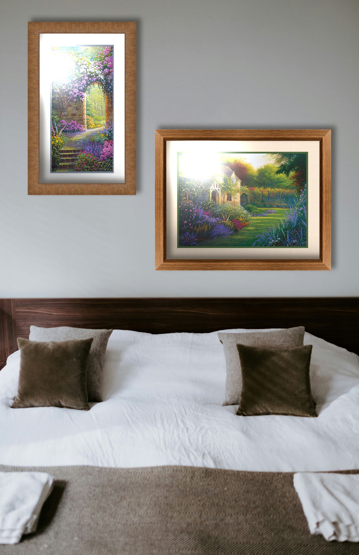 Two paintings hanging on a bedroom wall. The first is a painting of a flower garden enclosed by a stone wall. A stone path leads through an archway in the wall, where sunlight pours through trees in the distance. Printed on paper, matted, and framed. The second is a painting of a blooming garden, with flowers in a variety of pinks, purples, yellows, and whites. A bench site in the grassy clearing beside a cottage, draped in white-flowered vines. Printed on paper, matted, and framed.