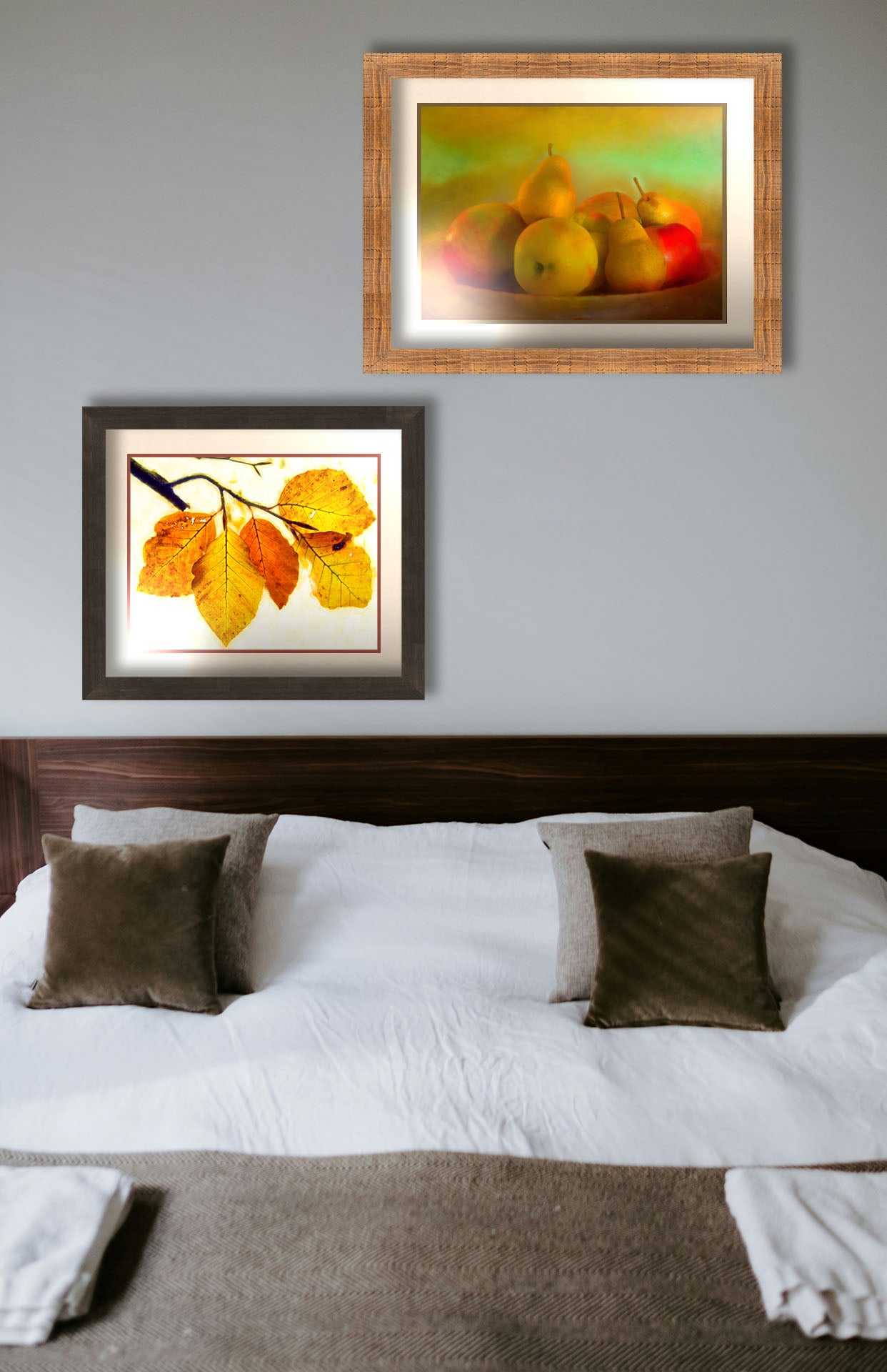 Two paintings hanging on a bedroom wall. The first is a photo of a dish of apples and pears, in a greenish yellow light. Printed on paper, matted, and framed. The second is a photo of a twig of orange and yellow leaves on a white background. Printed on paper, matted, and framed.