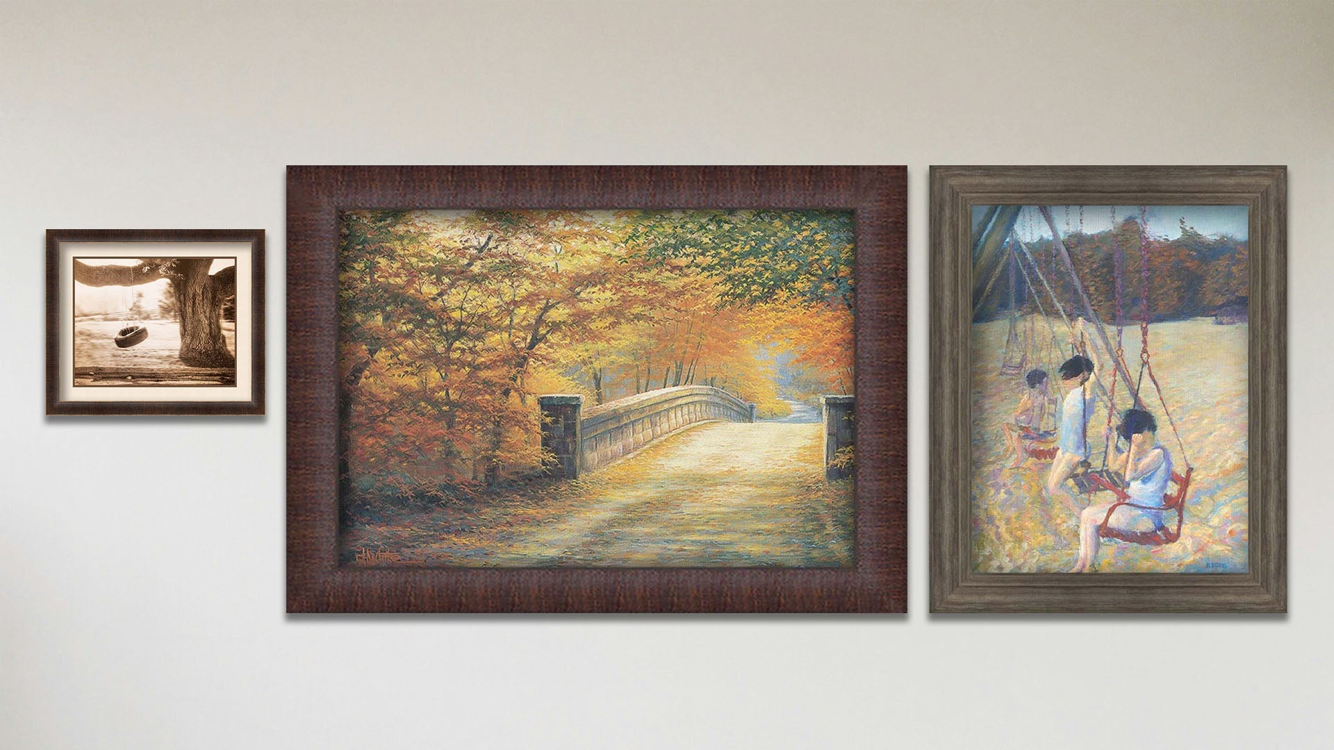 A collage of art in the designer Swingers package, including a framed painting of children playing on a swing set, a framed painting of a road through an autumn forest, and a matted and framed sepia photo of a tire swing hanging from a broad tree.