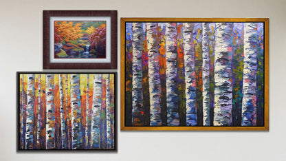 A collage of art in the luxury Tangerine Dream package, including two float framed paintings of colorful birch forests and a matted and framed painting of a garden with a koi fishpond.