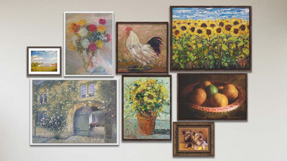 A collage of art in the luxury Bird Food package, including five float framed paintings of a sunflower field, a rooster, a pot of sunflowers, a vase of carnation flowers, and a courtyard garden; a float framed photo of a bowl of fruit; a matted and framed painting of two terriers with a tennis ball; and a matted and framed photo of a barn and sky overlaid with the words "I love this life".