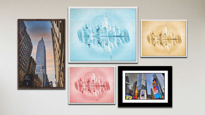 A collage of art in the luxury Blue City package, including a matted and framed photograph of Times Square in New York City, a float framed photograph of the Empire State Building in New York City, and three float framed photographs of the city skyline in red, yellow, and blue.