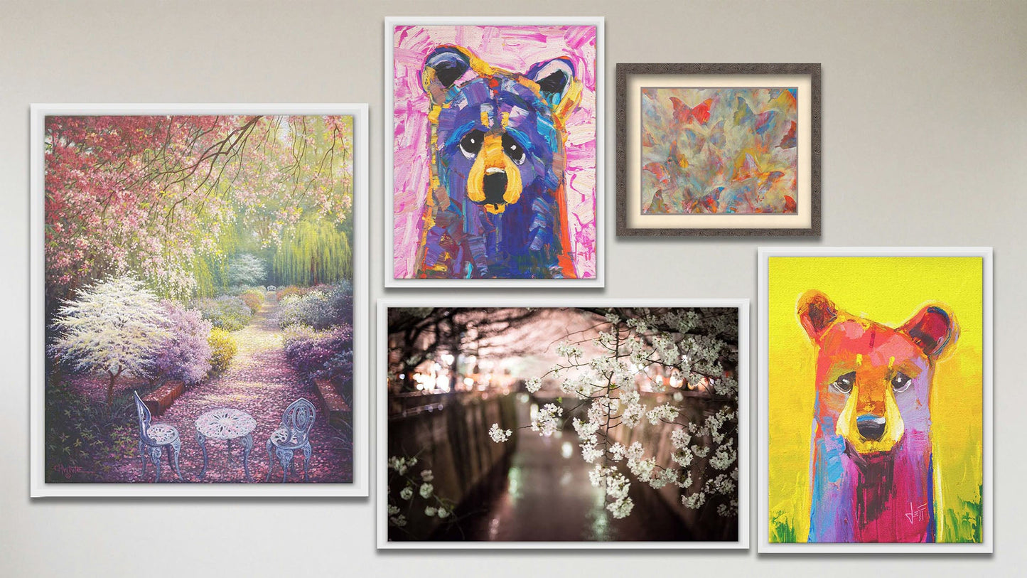 A collage of art in the luxury Tangerine Dream package, including two float framed paintings of colorful stylized bears, a float framed painting of a garden blossoming with cherry trees, a float framed photograph of cherry blossoms in Japan, and a matted and framed painting of butterflies.