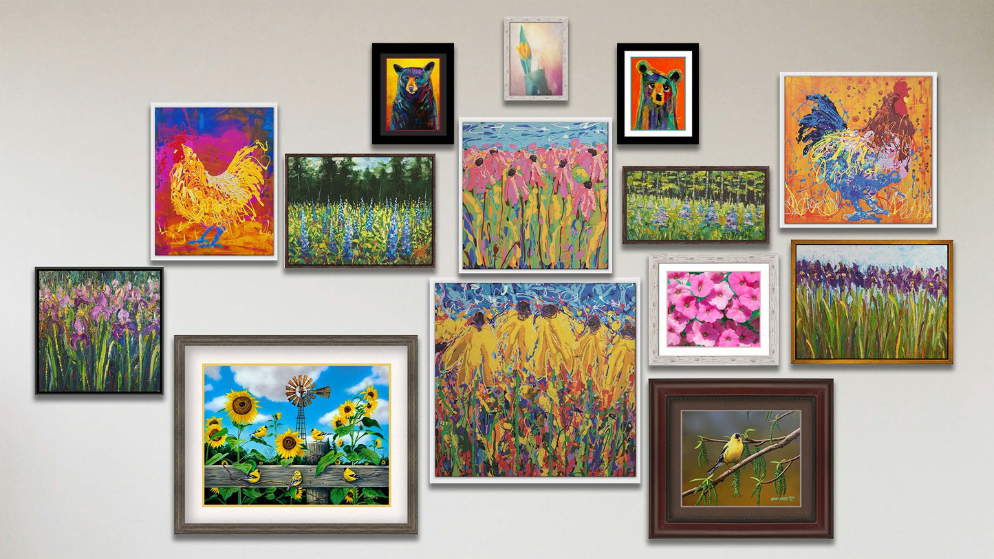 A collage of art in the luxury Dressed in Yellow package, including two float framed drip paintings of roosters, two float framed drip paintings of coneflowers, two float framed paintings of irises, two float framed paintings of lupines, two matted and framed paintings of colorful bears, a matted and framed painting of gold finches on sunflowers, a matted and framed painting of a gold finch on a twig, a matted and framed photo of pink flowers, and a framed photo of a yellow tulip.