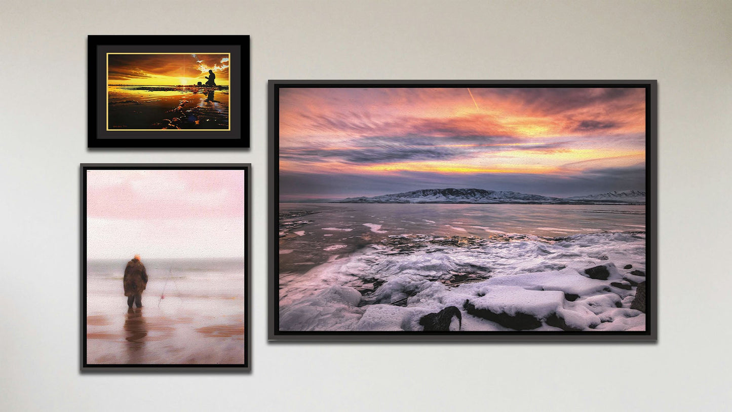 A collage of art in the luxury Tranquil Harbor package, including a float framed photograph of a sunset over a snowy shore, a float framed photograph of a fisherman watching their line in the ocean shallows, and a matted and framed painting of a person fishing on an icy shore.