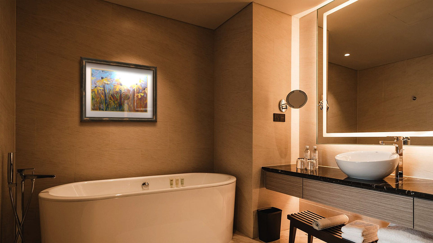 A warm-toned bathroom with a large tub. A matted and framed painting of coneflowers hangs on the wall.