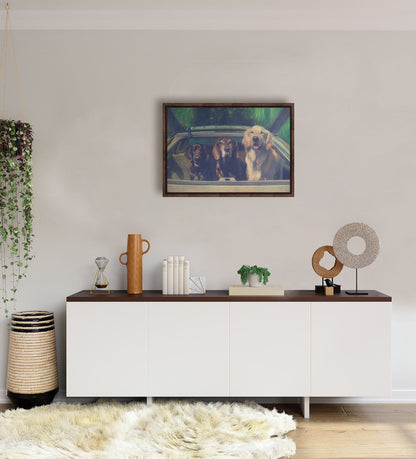 A white-walled room with a long, white cabinet decorated with sculptures, plants, and a woven basket. A float framed painting of three dogs riding in a car hangs on the wall.