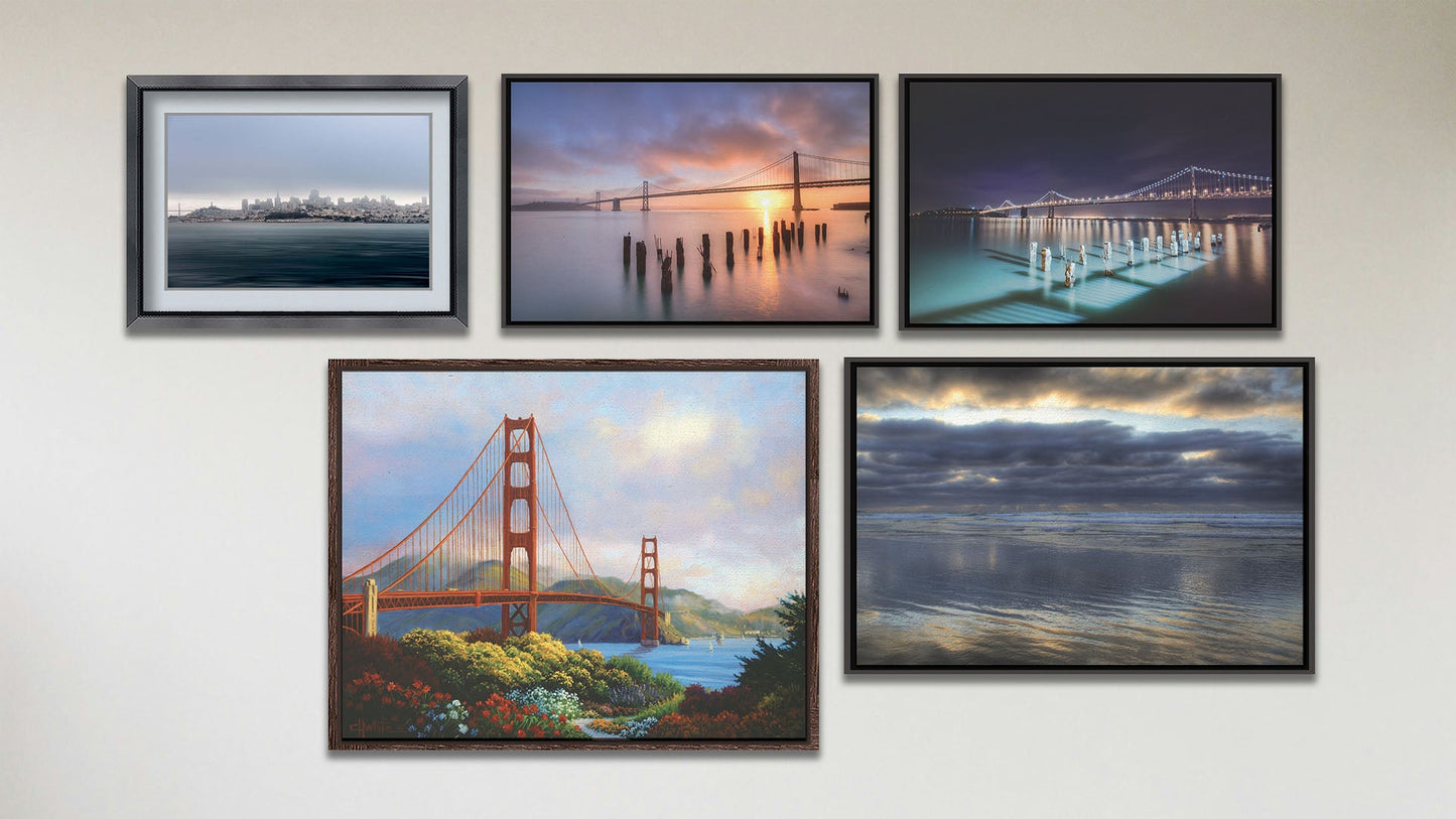 A collage of art in the luxury Morning at the Golden Gate package, including three float framed photos of San Francisco at sunrise, San Francisco at night, and Scripps Pier in La Jolla, CA; a float framed painting of the Golden Gate Bridge; and a matted and framed photograph of the San Francisco, California, skyline.