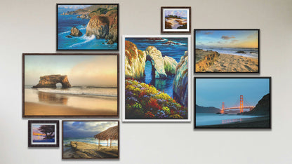 A collage of art in the luxury Santa Cruz Natural Bridges package, including two float framed photographs of Windansea Beach, La Jolla, California; two float framed photographs of Baker Beach and the Santa Cruz Natural Bridges; two float framed paintings of Point Lobos and Big Sur, California; and two matted and framed paintings of Caramel Beach and Asilomar, California.