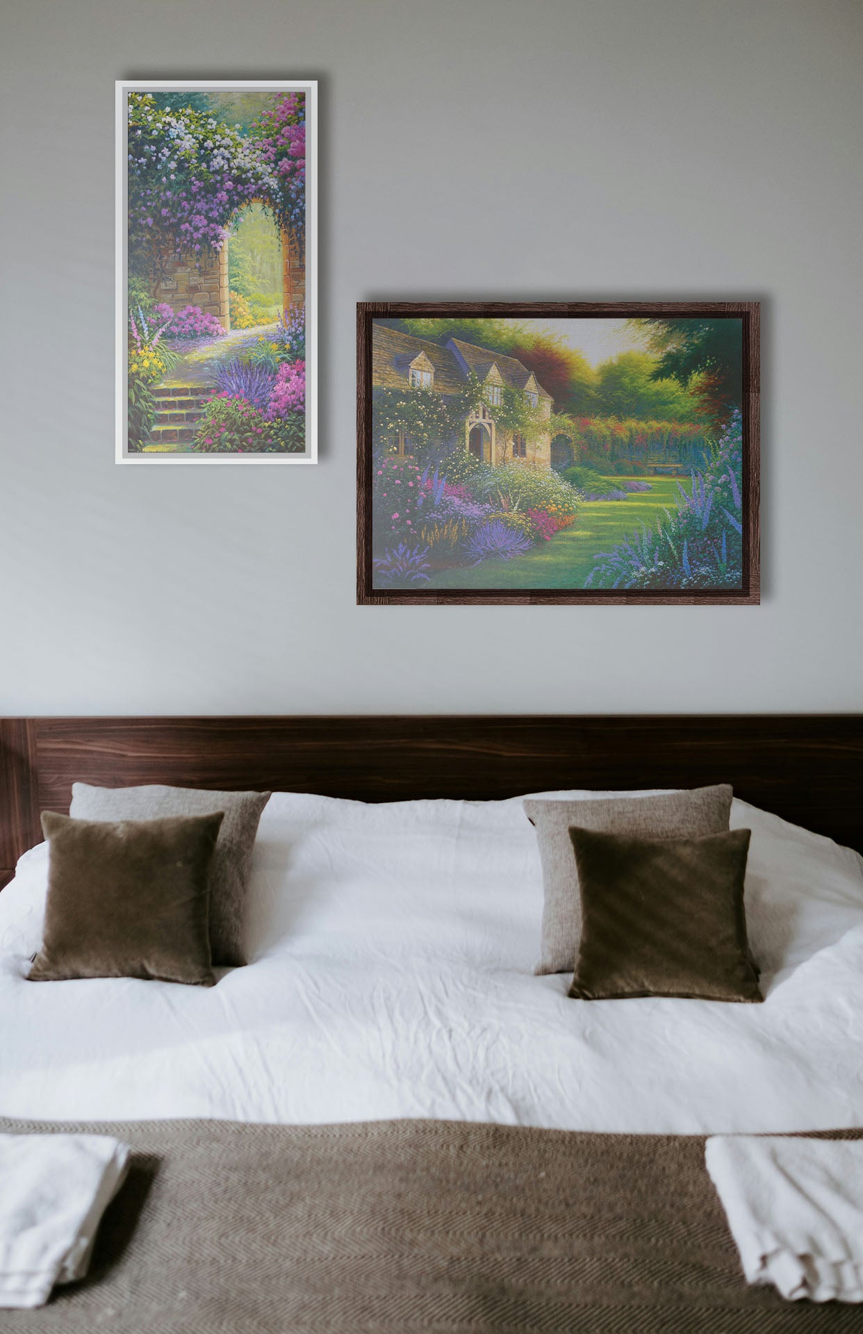 Two paintings hanging on a bedroom wall. The first is a painting of a flower garden enclosed by a stone wall. A stone path leads through an archway in the wall, where sunlight pours through trees in the distance. Printed on canvas in a float frame. The second is a painting of a blooming garden, with flowers in a variety of pinks, purples, yellows, and whites. A bench site in the grassy clearing beside a cottage, draped in white-flowered vines. Printed on canvas in a float frame.