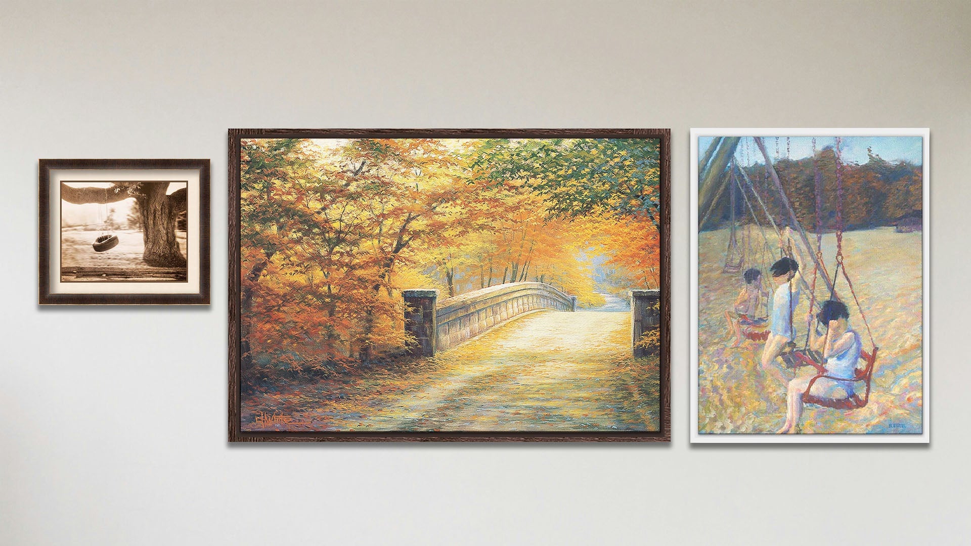 A collage of art in the luxury Swingers package, including a float framed painting of children playing on a swing set, a float framed painting of a road through an autumn forest, and a matted and framed sepia photo of a tire swing hanging from a broad tree.